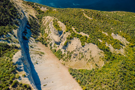 Aerial view of sea coastline with canyon and cliffs in Greece