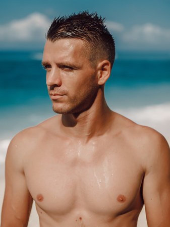 Portrait of an attractive young man on a tropical beachの写真素材