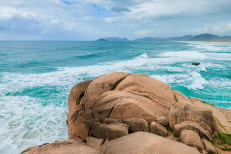 Scenic coastline with turquoise ocean and waves in Brazil.の写真素材