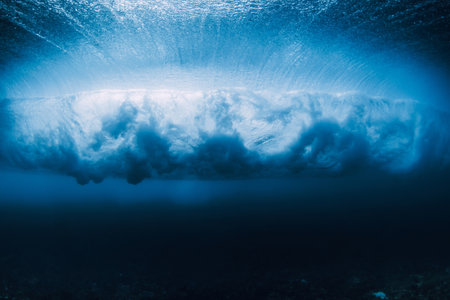 Wave underwater. Blue ocean in underwater. Surfing barrel wave