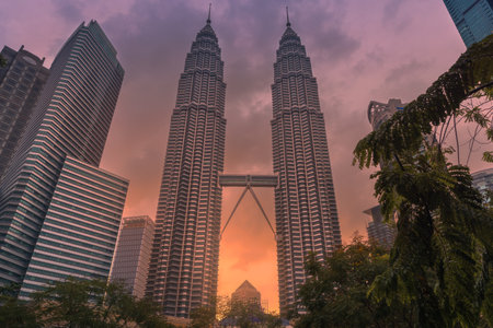 May 25, 2024. Kuala Lumpur, Malaysia. Petronas skyscrapers with sunset tones. Twin towers in KL center.のeditorial素材