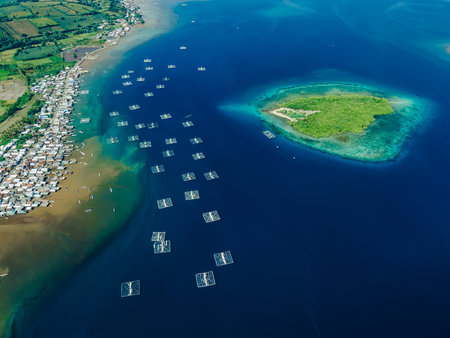 Indonesian fishing village and fishing boats in ocean on Sumbawa island. Scenic drone view.の写真素材