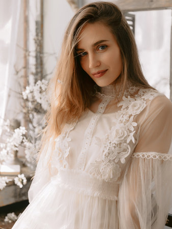 Portrait of beautiful woman with natural flawless skin, wearing vintage style dress.の写真素材