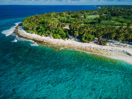 Fuvahmulah island, ocean and tropical beach with palms in sunny day. Maldive landscapeの写真素材