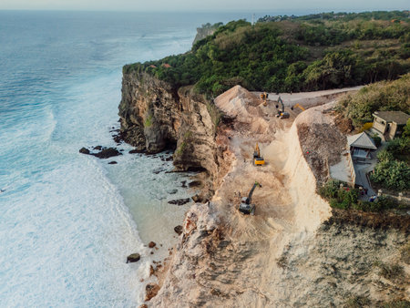 Bulldozer on the cliff in Uluwatu, Bali. Drone viewの写真素材