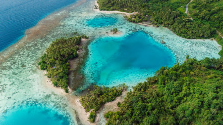 Ocean coastline with blue lagoon and tropical scenic landscape in Indonesia. Aerial viewの写真素材
