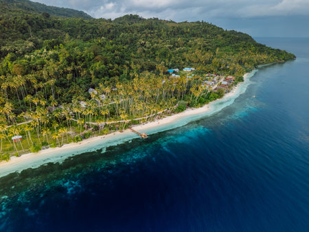 Tropical coastline with sandy beach and quiet sea in Indonesia. Travel destination concept.の写真素材
