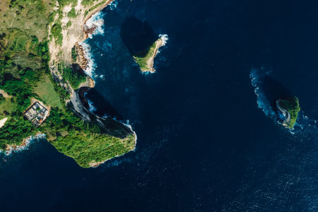 Scenic coastline with rocky cliffs and ocean in Nusa Penida. Top down view