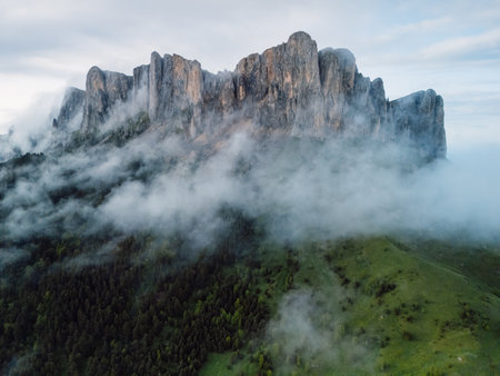 Aerial view of rock mount Bolshoy Tkhach with clouds in Caucasus mountainsの写真素材