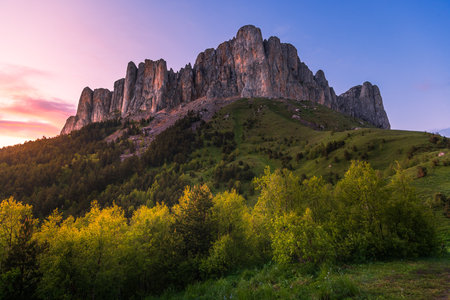 Scenic view of Bolshoy Tkhach mountain in national park with sunset sky tonesの写真素材