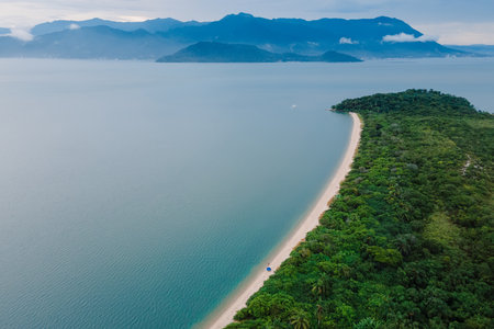 Beach with quiet sea, mountains and cloudy sky in Florianopolis, Brazil. Aerial viewの写真素材