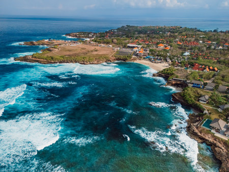 Scenic coastline with crashing waves in ocean on Nusa Lembongan island, drone viewの写真素材