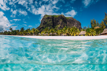 Tropical crystal ocean with mountain and luxury beach in Mauritius.の写真素材