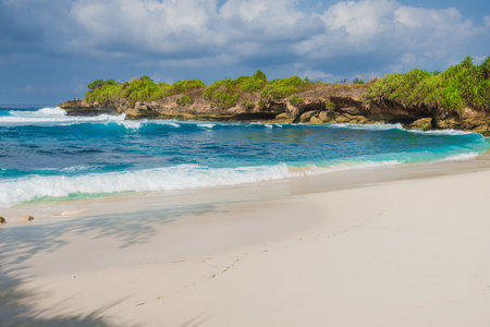 Tropical paradise beach with blue ocean in Lembongan, Indonesiaの写真素材