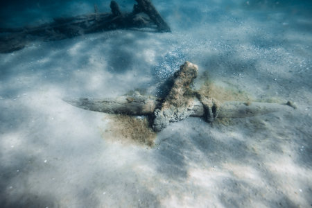 Wreck ship underwater on sandy sea bottomの写真素材
