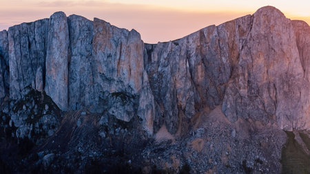 Drone photo of Bolshoy Tkhach mountain rocks in Caucasus with sunset or sunrise tonesの写真素材