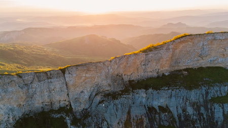 Aerial view of stone mount in Caucasus mountains with soft sunrise tonesの写真素材