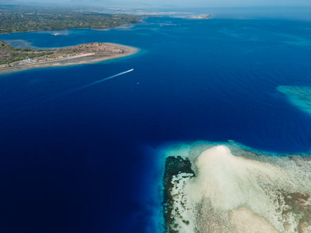Seascape aerial view over sand bank with blue ocean water in Baliの写真素材