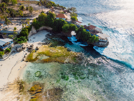 Coastline and ocean with waves in Nusa Ceningan island, Bali. Aerial viewの写真素材