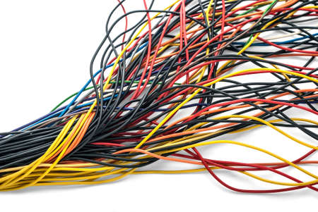 Twisted bundle of computer multicolored cables isolated on white background. の写真素材
