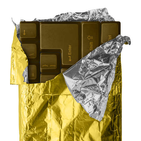 Computer keyboard chocolate wrapped in gold/silver aluminum foil. Hi Res image isolated on white.の写真素材