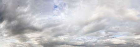 Clear grey sky and clouds background panorama. High resolution, multi-frame composite.の写真素材