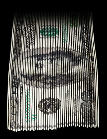 Shredded US hundred dollar bill on black background. Concept for money wasting, money value and savings.の写真素材