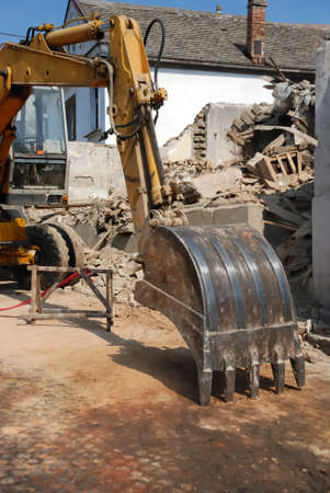 Excavator Bucket Resting after house demolition.