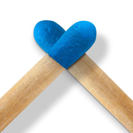 Macro matchsticks heart shaped on white background. A blue heart can symbolize a deep and stable love. Trust, harmony, peace and loyalty.の写真素材