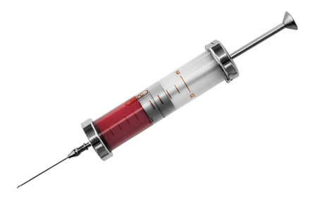 An old glass syringe with blood, isolated on white background. Vintage medical equipment.の写真素材