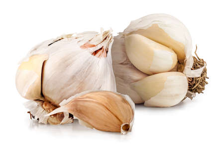 Fresh ripe organic cloves of garlic isolated on white.の写真素材
