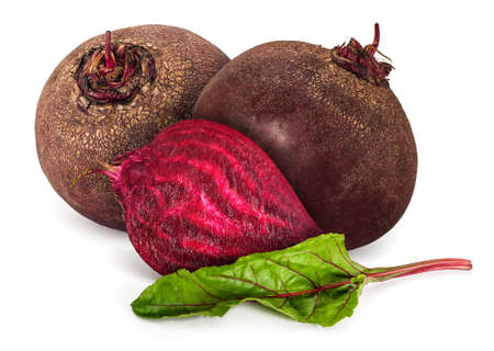 Two and a half raw beetroot (Beta vulgaris) with leaf, isolated on a white background.の写真素材