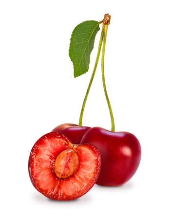 Two cherries (Prunus avium) and juicy cherry berry cut in half with bone and green leaf isolated on white background.の写真素材