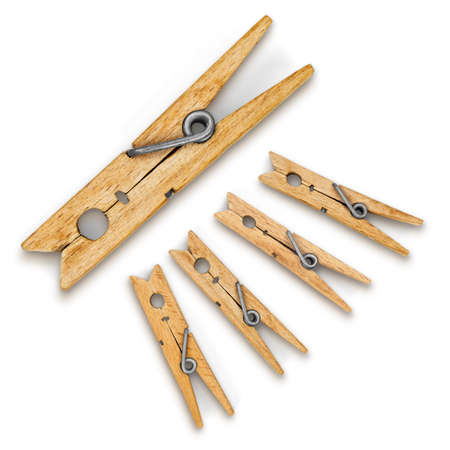 Wooden clothespins as a conceptual composition, isolated on a white background.の写真素材