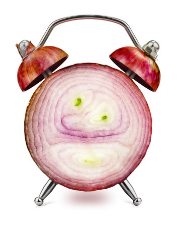 Cross-section of the onion, as an alarm clock, on a white background.の写真素材