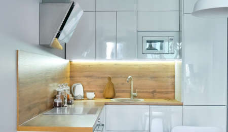 Modern kitchen interior with wooden and white elements, domestic life, home showcase interior conceptの写真素材