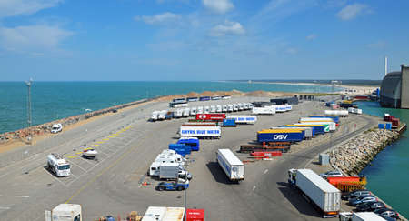 Hirtshals, Denmark - May 31, 2014: Trucks and buses waiting in the parking lot of the ferry terminal on the loading Onto a ferry to Iceland and the Faroe Islands. Hirtshals is an important ferry port in the north of Denmark.のeditorial素材