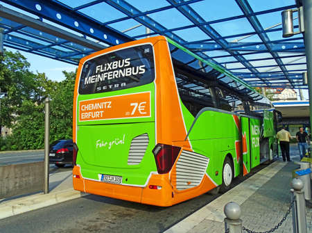 Chemnitz, Germany - July 24, 2015: A luxury long-distance coach of the company MeinFernbus FlixBus is ready for departure to Dresden at the bus station in Chemnitz. The coach of the type Setra is operated by the company Baumann bus operation from Munichのeditorial素材