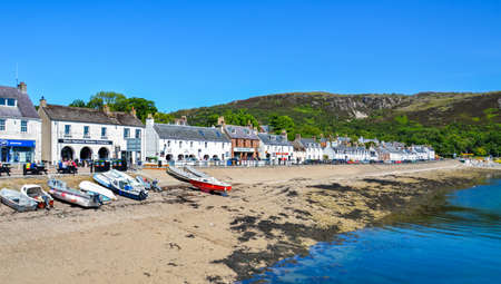 Ullapool, United Kingdom - June 24, 2018: Coast with small houses in the Ullapool village in...