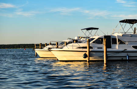 Gohren-Lebbin, Germany? July 9, 2017: Houseboats are moored at the pier of Fleesen Lakeのeditorial素材