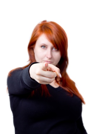 red-haired woman pointing at youの写真素材