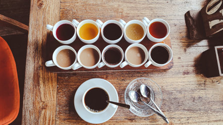 Coffee cup on wooden table in coffee shop, stock photoの写真素材