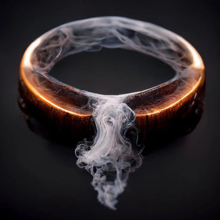 Wooden ring with smoke on a black background, close-upの写真素材