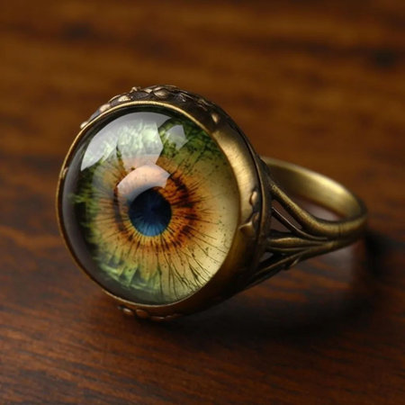 wedding ring with an iris on a wooden background.の写真素材