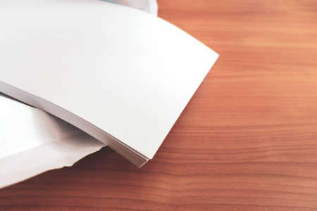 printing and photocopy paper. stack of sheets of a pack of office paper on a table. paper for high...