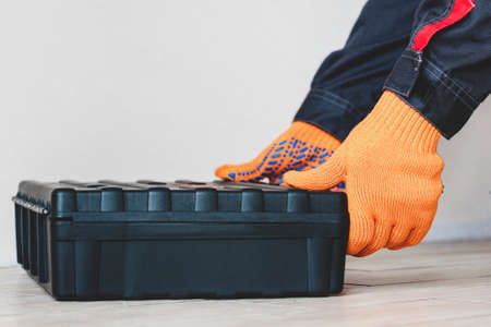 person with a case. master with tool box.close up. Worker gear concept