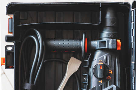 Hammer in a box close up. rotary hammer, rotary drill, perforator, chisel in a case for tools close up.の写真素材
