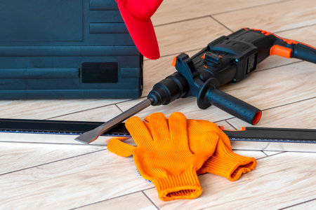 Working tools. rotary hammer, tool box, Bubble level, gloves. Worker gear concept