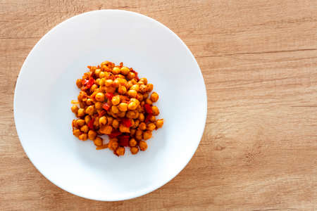 cooked beans on a plate, vegetarian dish, cooked chickpeas, vegetarianism concept, diet food, top viewの写真素材
