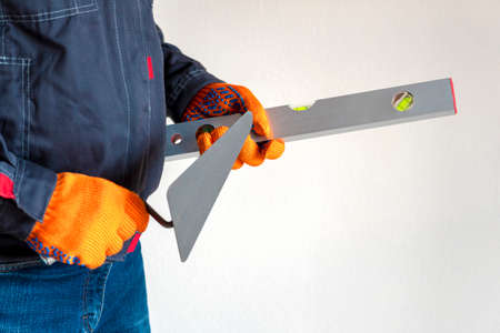 Working tools. gloves, bubble level, trowel. Worker gear concept